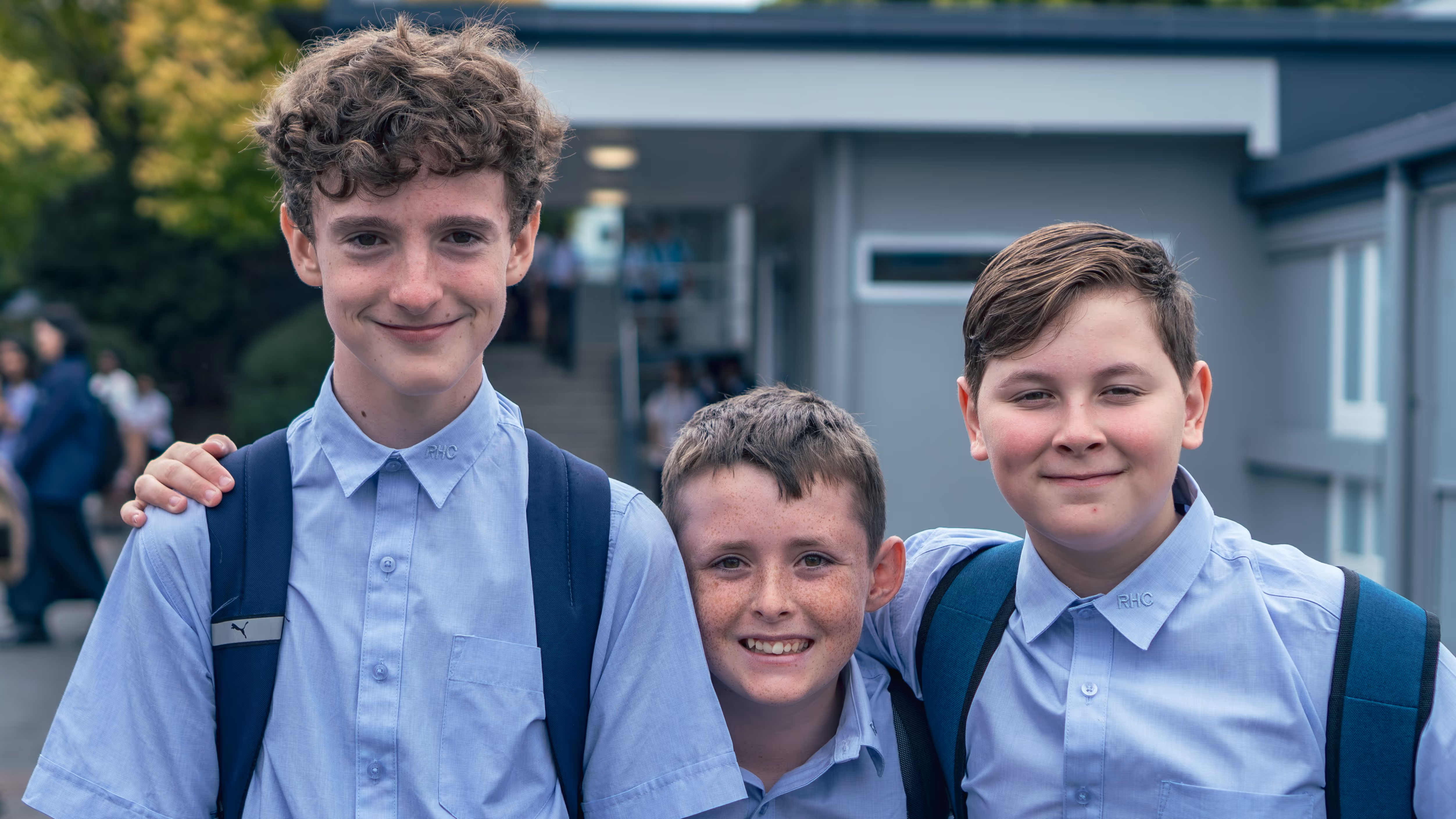 Three Rosehill College students together outside on campus